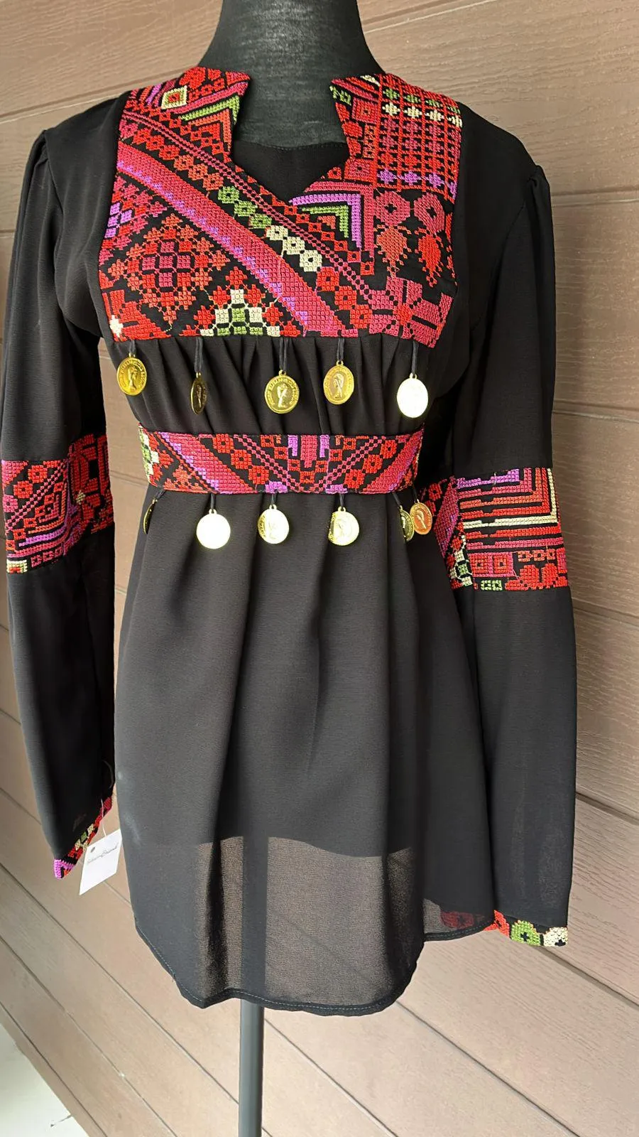 Black elegant blouse with red embroidery and stylish coins